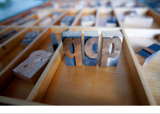 wood type drawer with letters 'q c p' standing on end
